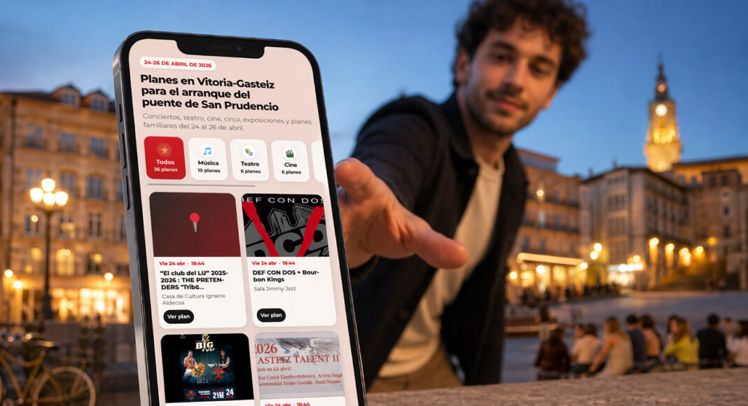 Un chico a punto de agarrar un móvil con la agenda de fin de semana de vitoria-gasteiz para este fin de semana antes de San Prudencio 2026